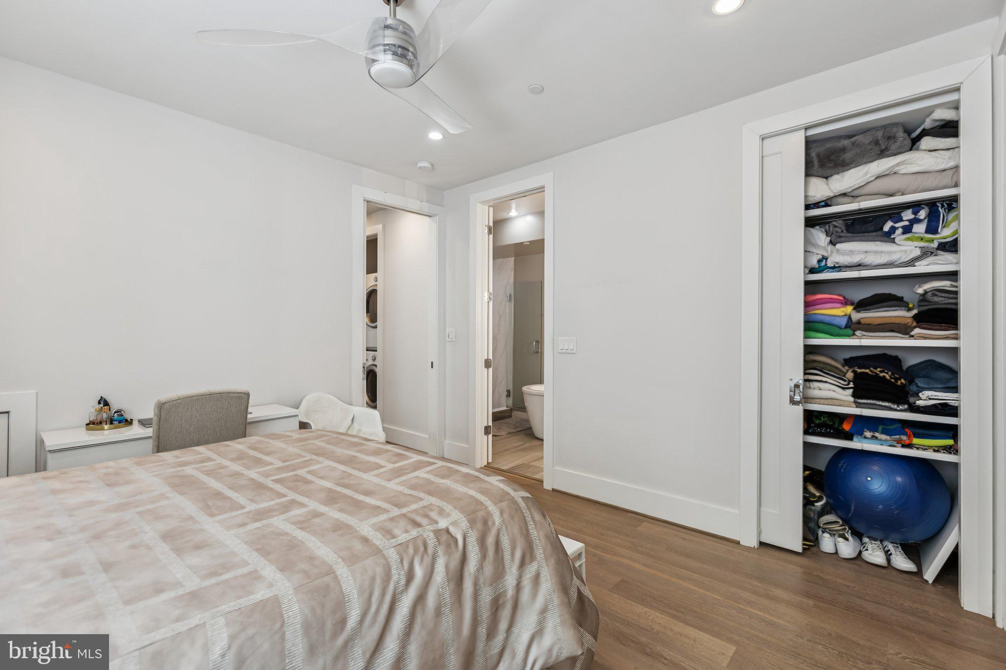 3919 Fulton Street Northwest, Unit 4 Washington, DC 20007 - Photo 18 of 31 a bedroom with a bed and cabinets