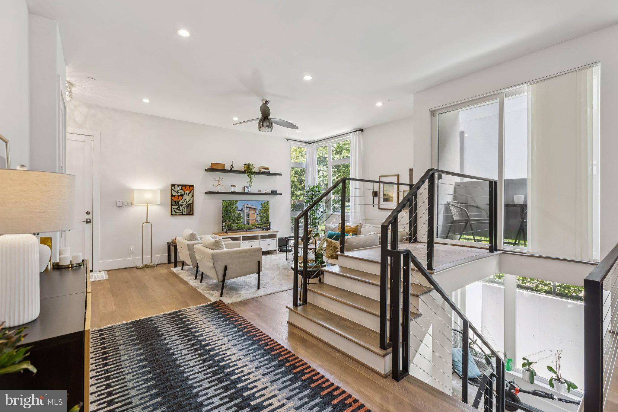 3919 Fulton Street Northwest, Unit 4 Washington, DC 20007 - Photo 3 of 31 a living room with furniture and wooden floor