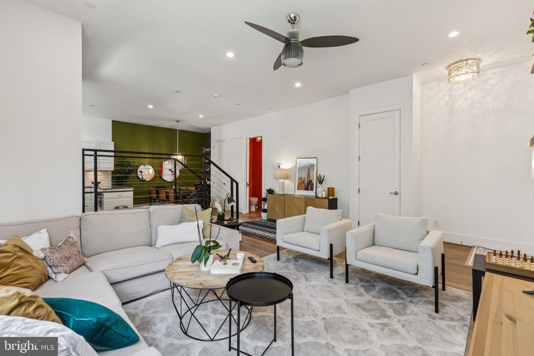 3919 Fulton Street Northwest, Unit 4 Washington, DC 20007 - Photo 4 of 31 a living room with furniture and a large window