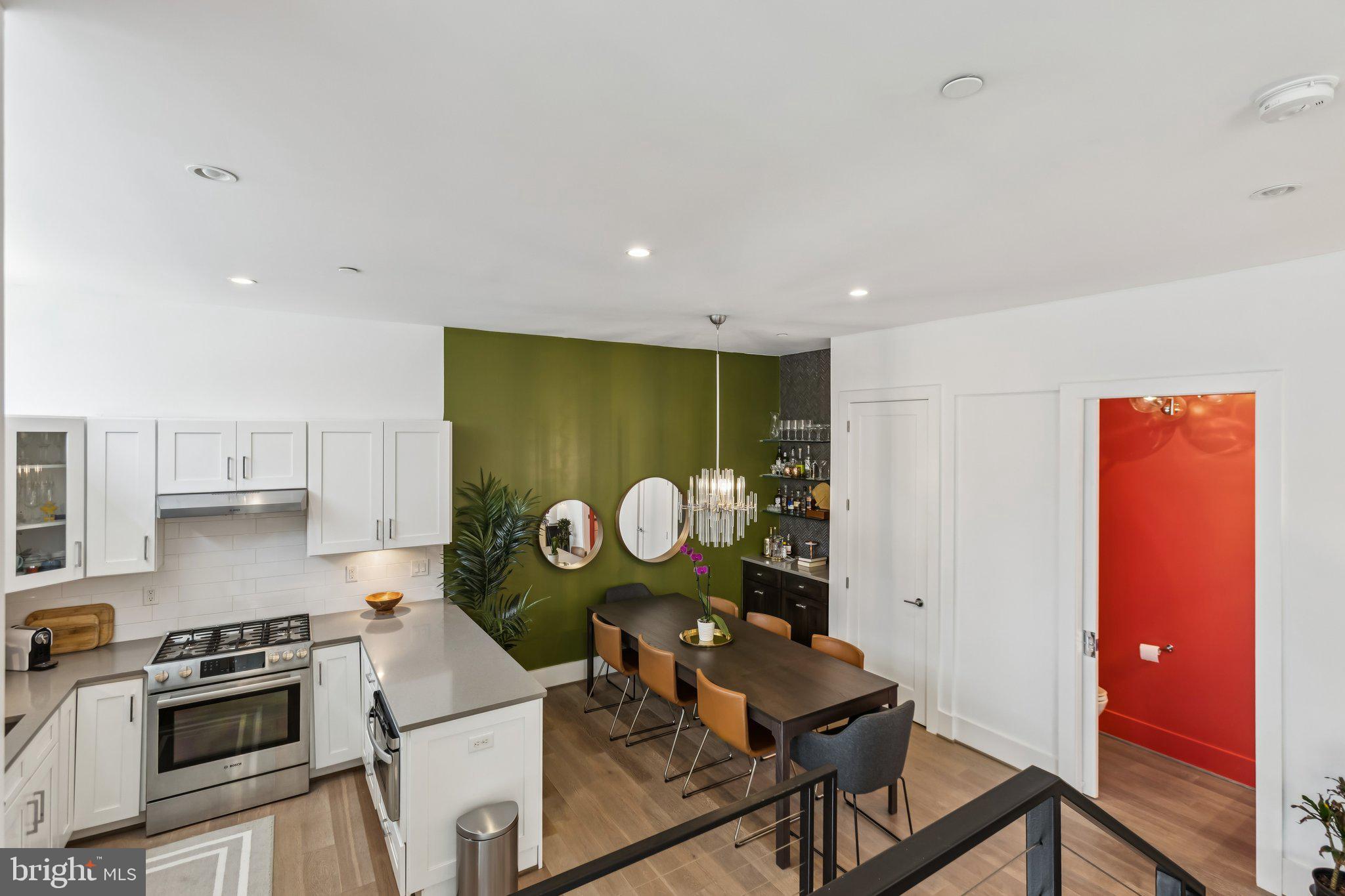 3919 Fulton Street Northwest, Unit 4 Washington, DC 20007 - Photo 6 of 31 a kitchen with stainless steel appliances granite countertop a stove a sink and a refrigerator