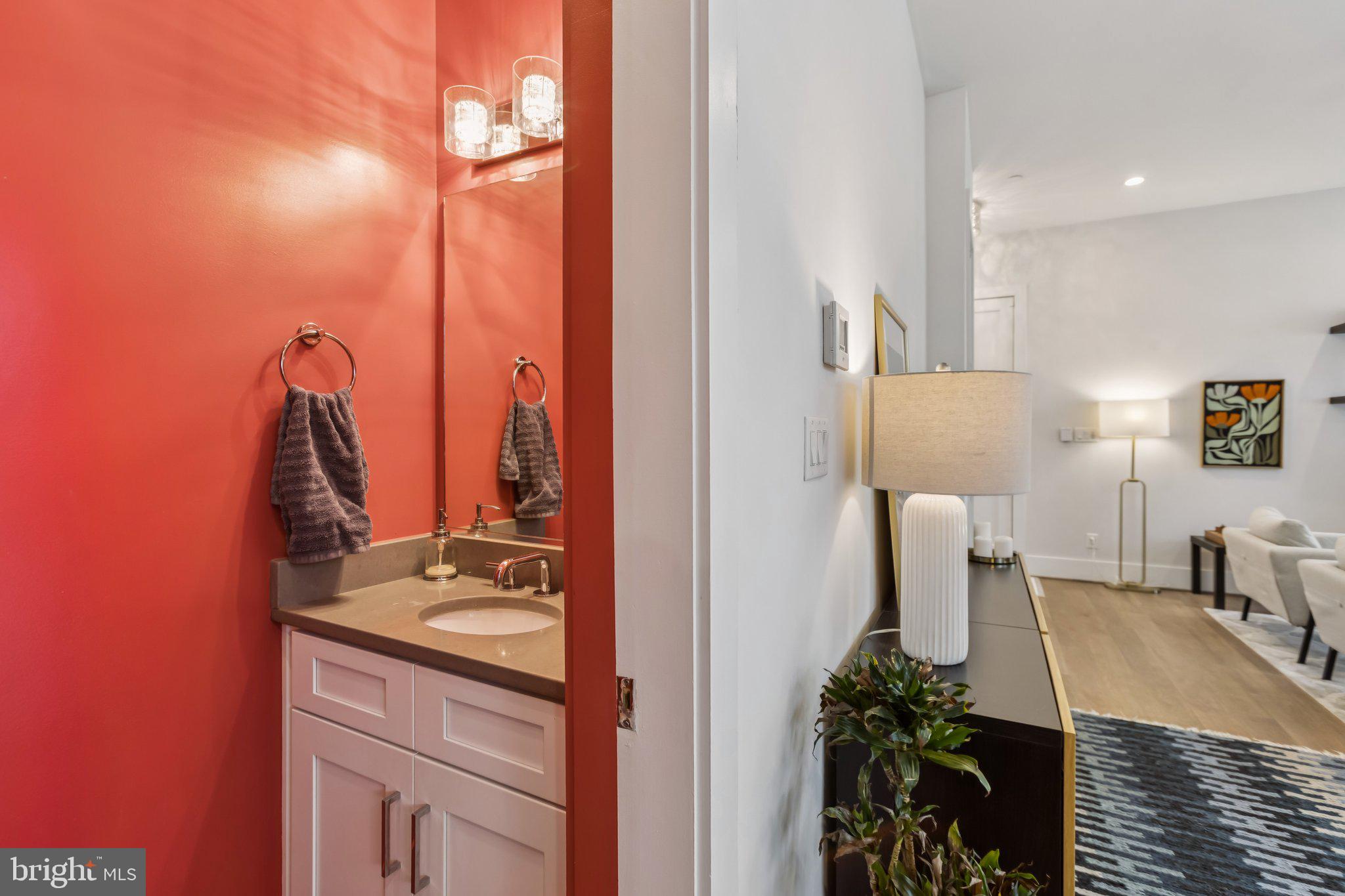 3919 Fulton Street Northwest, Unit 4 Washington, DC 20007 - Photo 9 of 31 a bathroom with a sink and a mirror