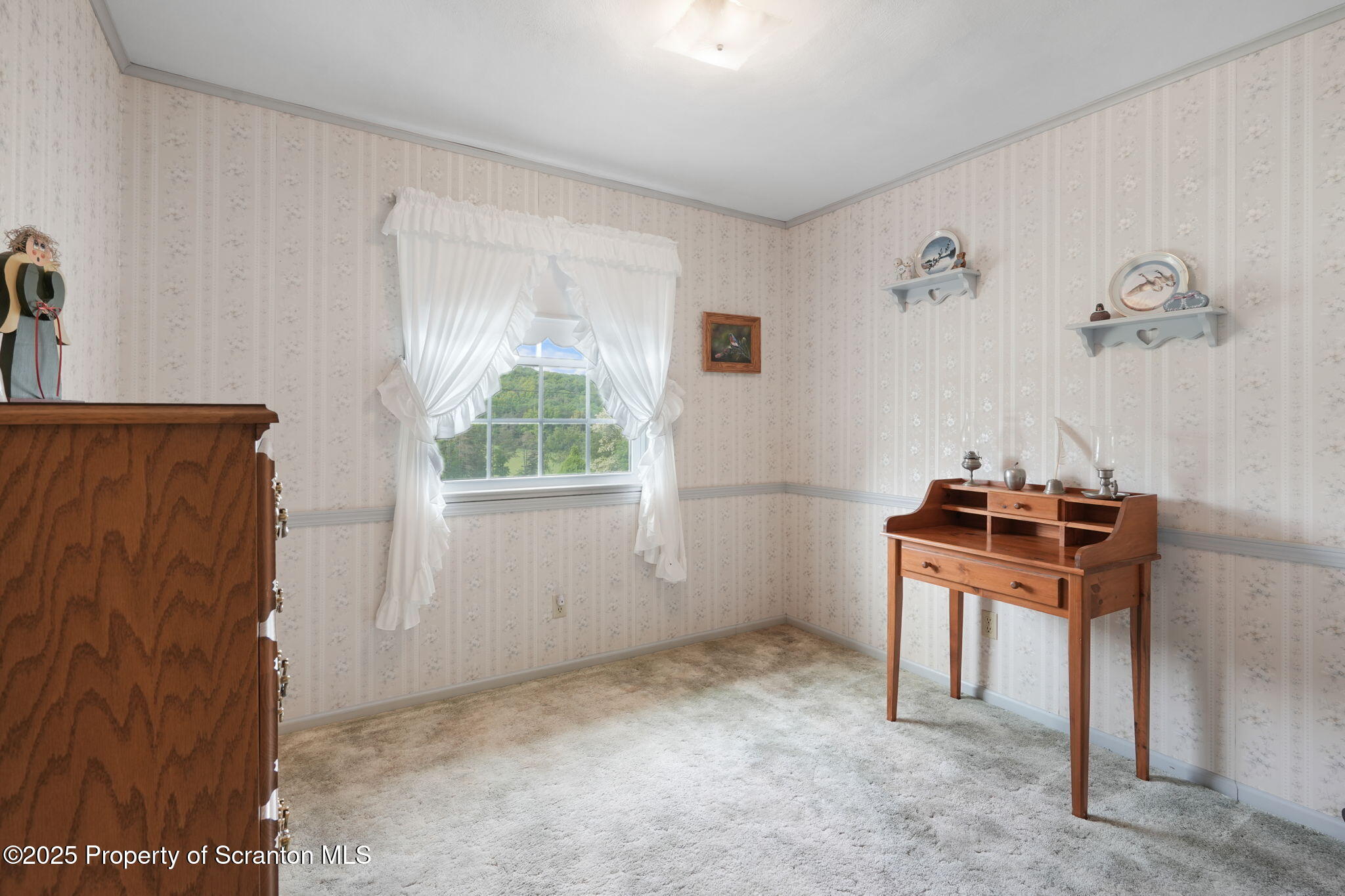 3374 Ridge Road Montrose, PA 18801 - Photo 16 of 31 a room with a stove and a window