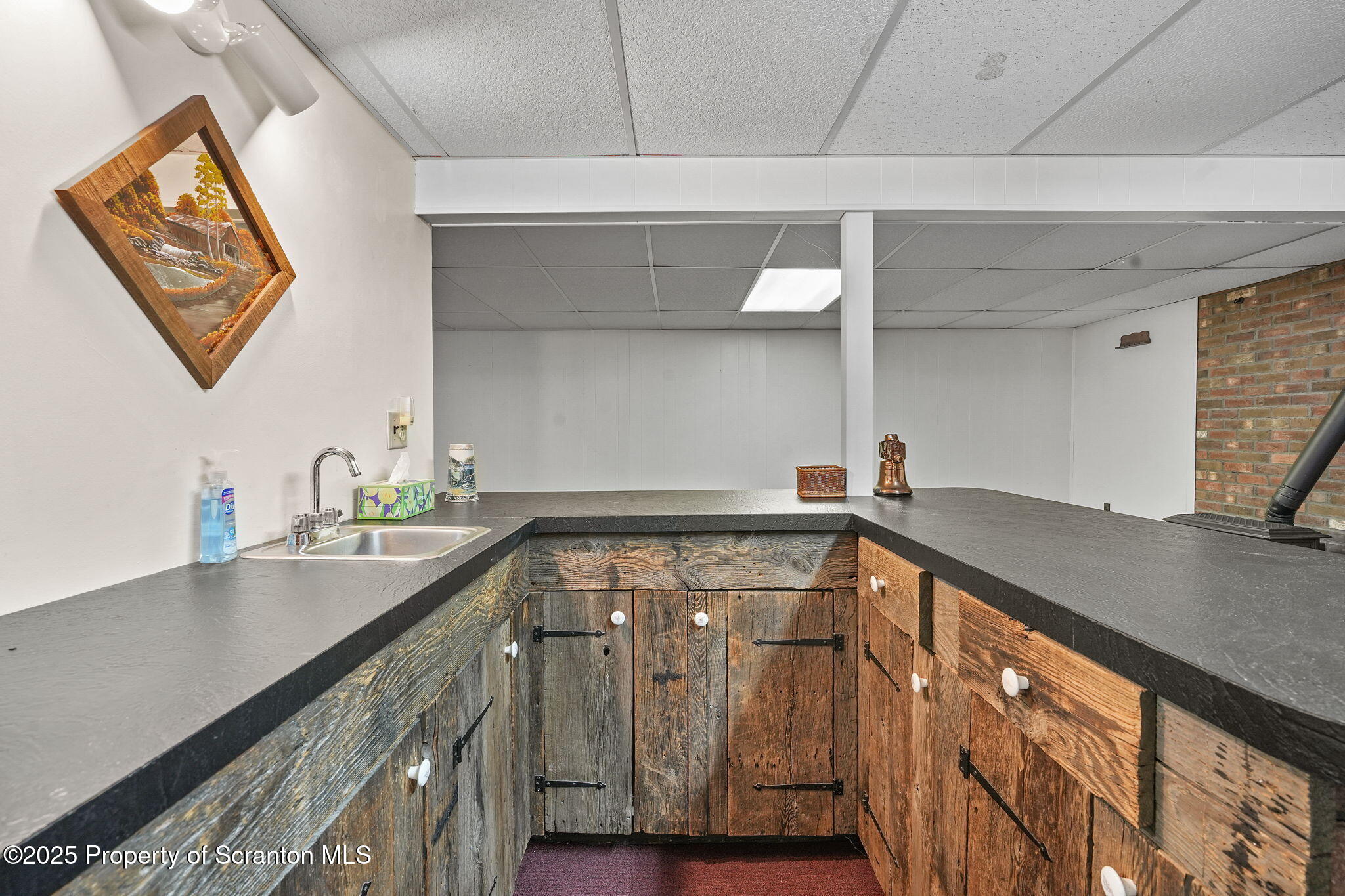 3374 Ridge Road Montrose, PA 18801 - Photo 25 of 31 a view of a kitchen with a sink and cabinets