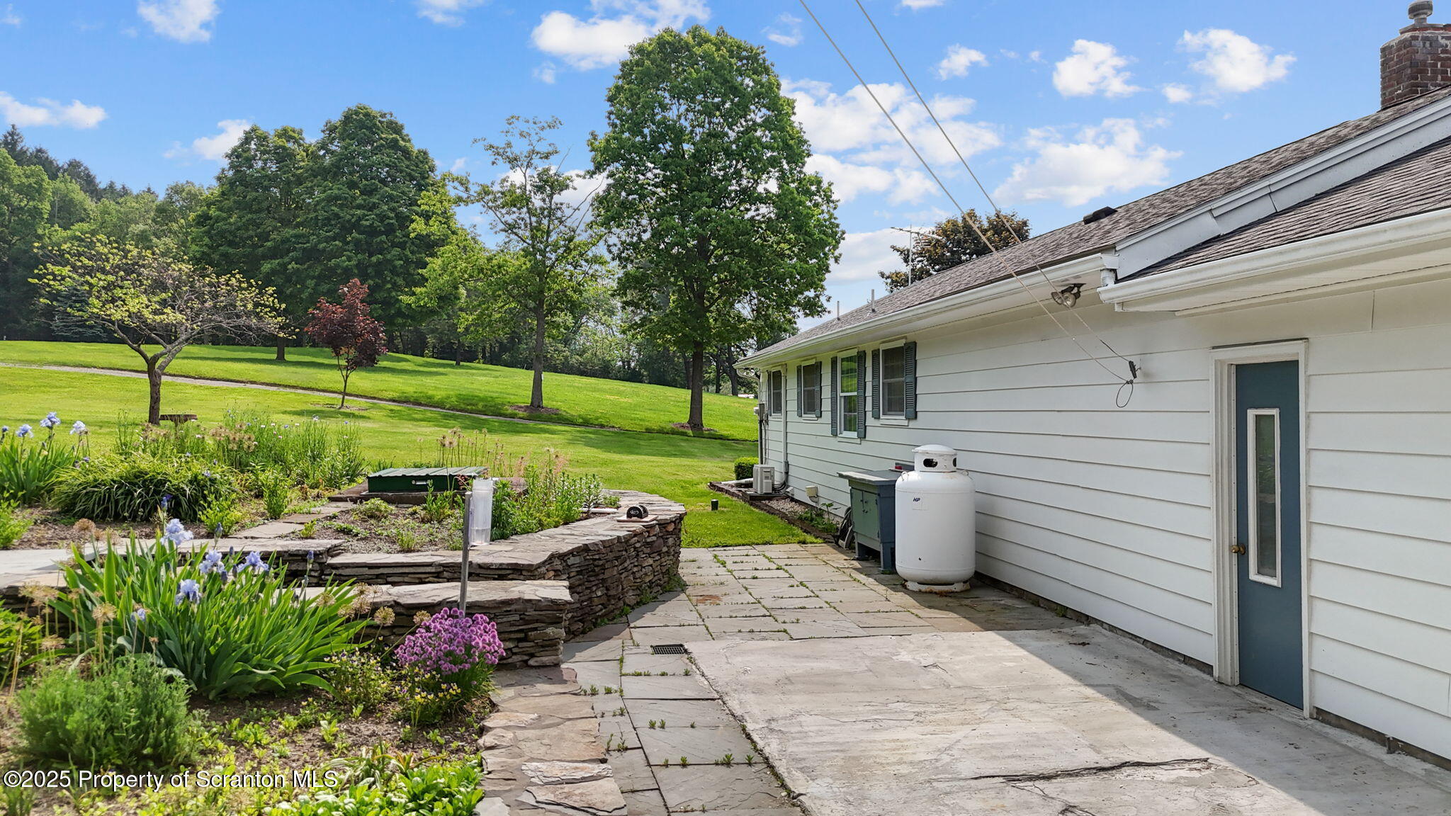 3374 Ridge Road Montrose, PA 18801 - Photo 29 of 31 a view of a patio with chairs and a yard