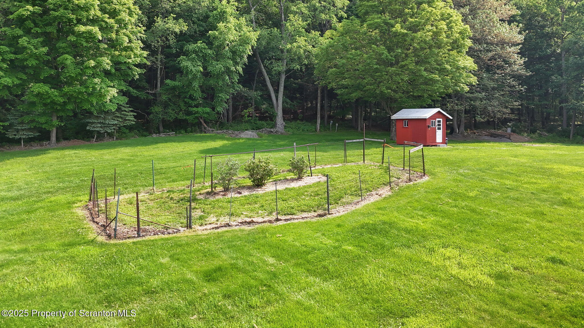 3374 Ridge Road Montrose, PA 18801 - Photo 4 of 31 a garden view with a seating space