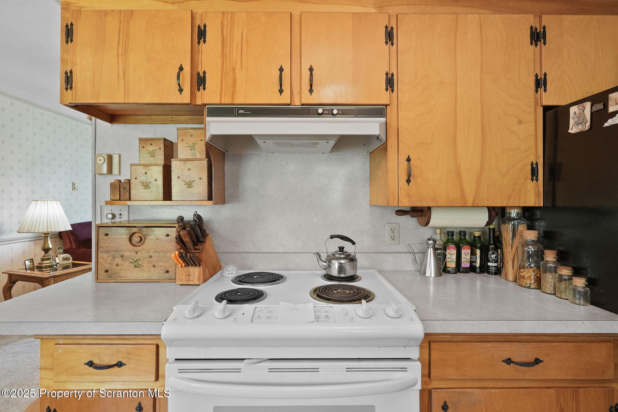 3374 Ridge Road Montrose, PA 18801 - Photo 9 of 31 a kitchen with a stove and a white cabinets