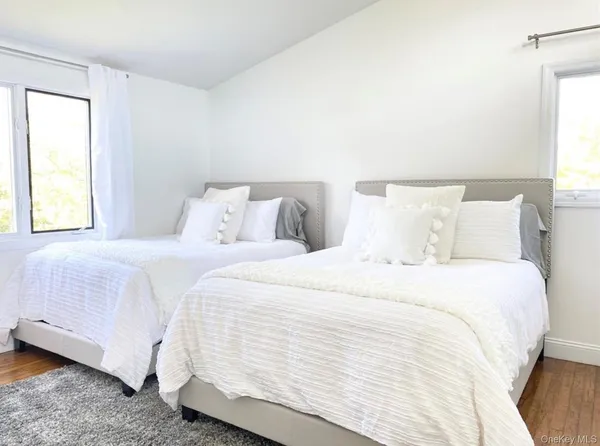 a bedroom with a bed and a night stand