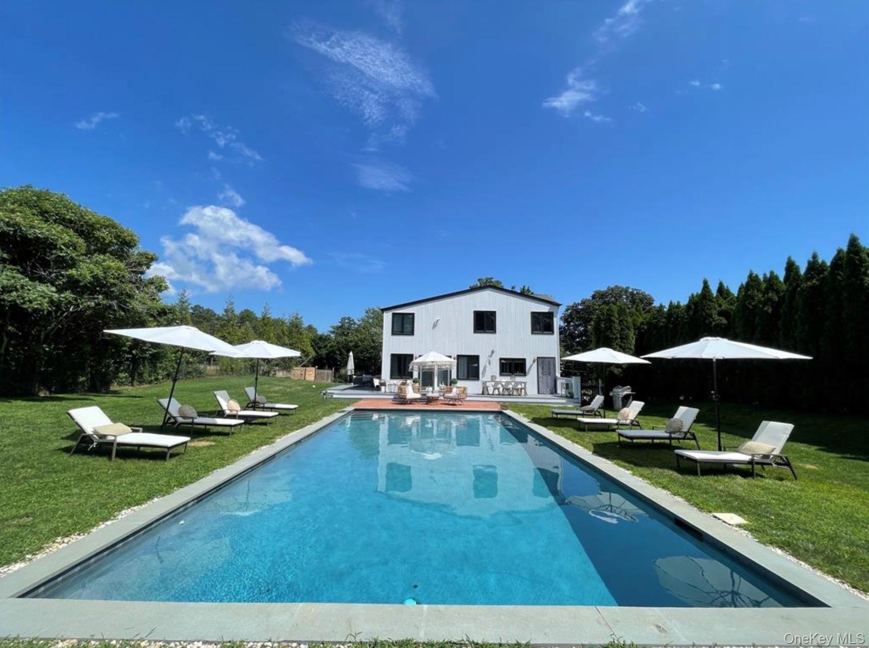 51 Cheviot Road Southampton, NY 11968 - Photo 13 of 22 a view of a house with swimming pool and sitting area