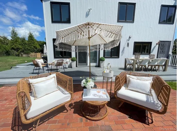 a outdoor living space with patio furniture and a fireplace