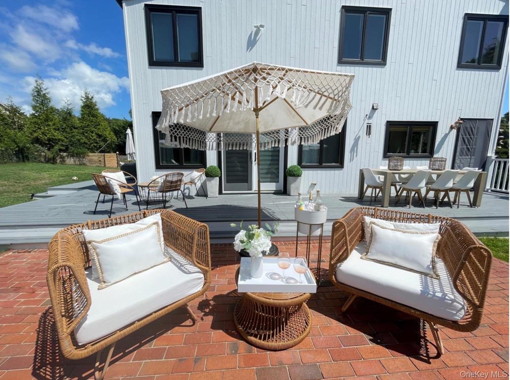 51 Cheviot Road Southampton, NY 11968 - Photo 14 of 22 a outdoor living space with patio furniture and a fireplace
