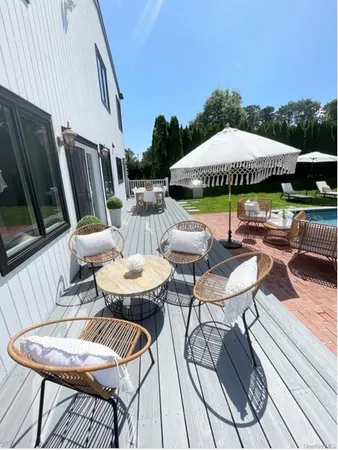 a view of a patio with furniture