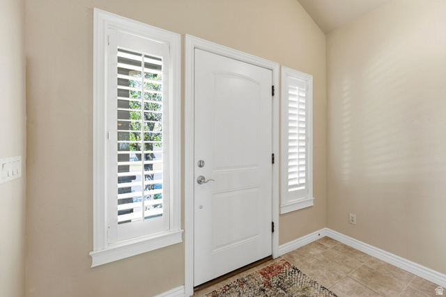 7235 Viansa Court Midvale, UT 84047 - Photo 2 of 43 Entryway featuring baseboards and light tile patterned floors