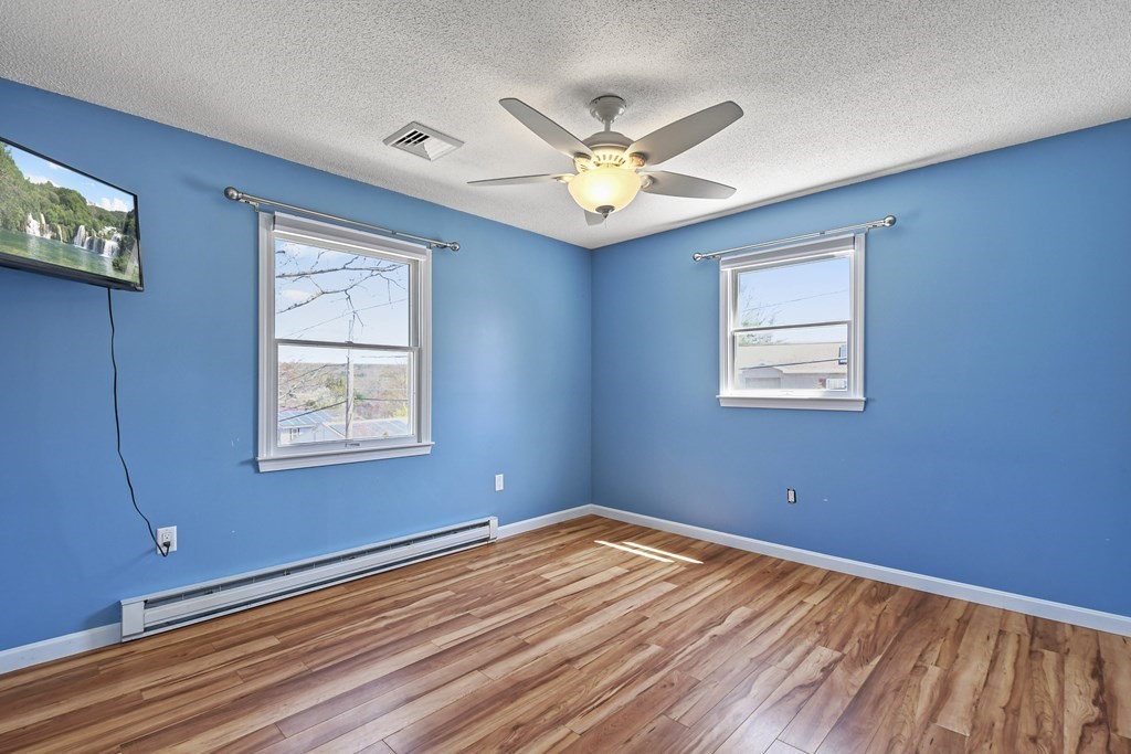 5 Jackson Road Webster, MA 01570 - Photo 12 of 30 a view of a room with wooden floor and windows