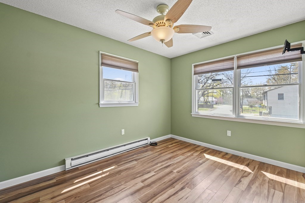 5 Jackson Road Webster, MA 01570 - Photo 17 of 30 a view of a room with window ceiling fan and wooden floor