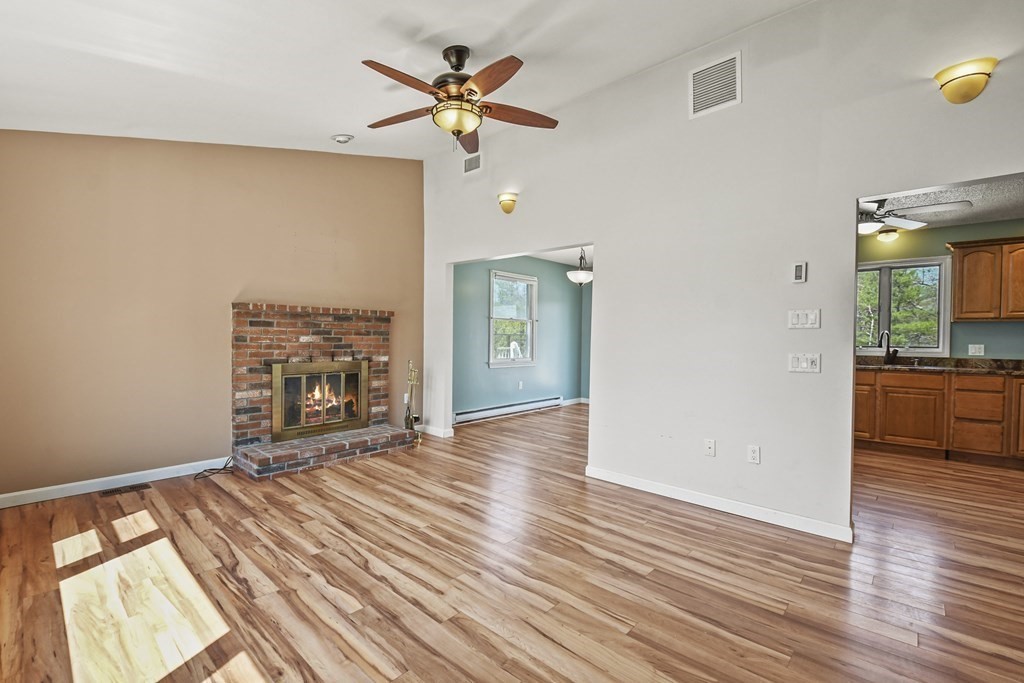 5 Jackson Road Webster, MA 01570 - Photo 4 of 30 wooden floor in an empty room with a window