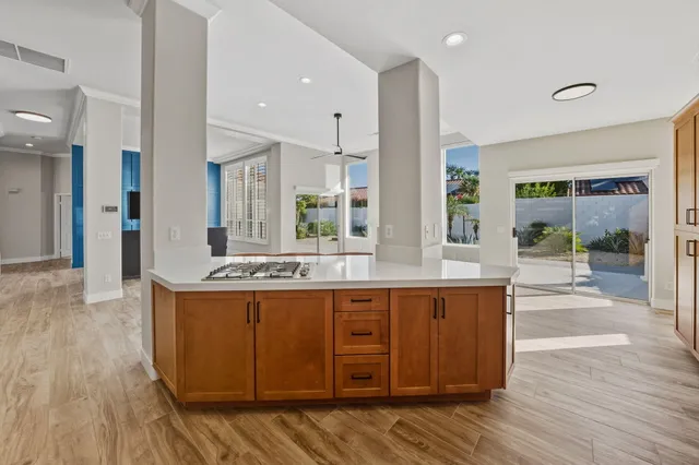 a large kitchen with stainless steel appliances granite countertop a large counter top and stove