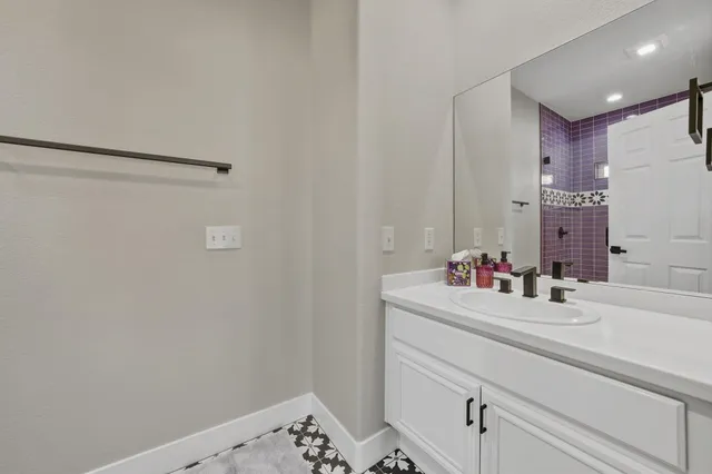 a bathroom with a sink and a mirror