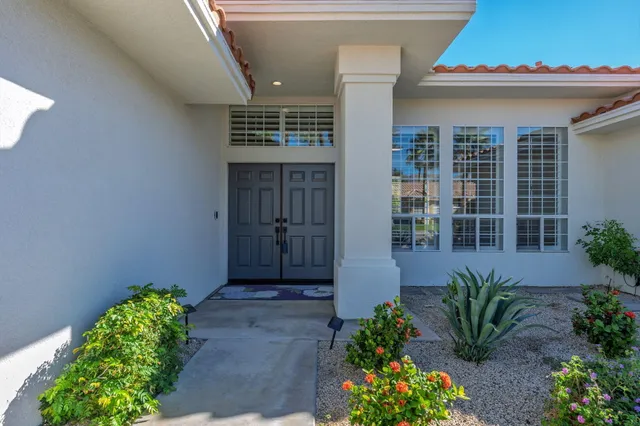 a view of a entryway with flower pots
