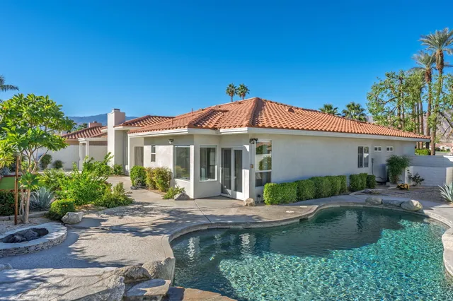 a front view of a house with swimming pool