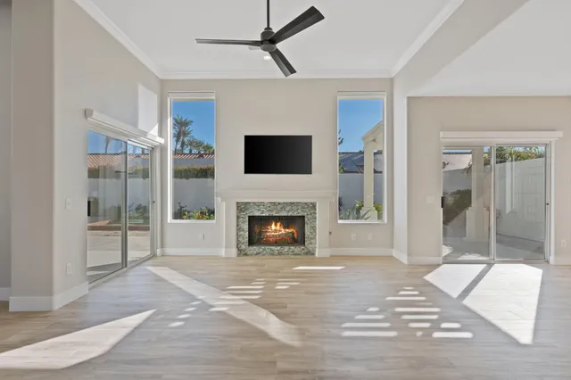 a living room with a fireplace and a flat screen tv