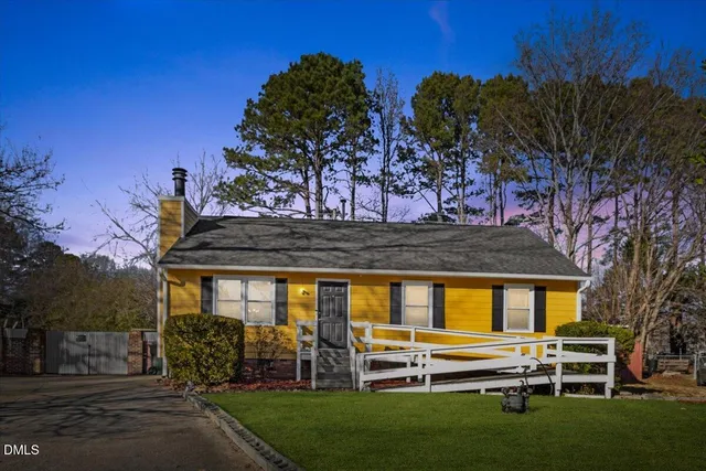 a view of a house with a backyard porch and sitting area