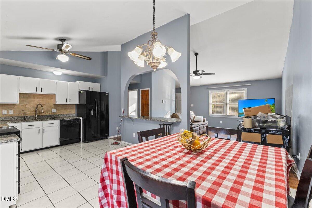 3612 Satellite Court Raleigh, NC 27604 - Photo 13 of 42 a open kitchen with stainless steel appliances granite countertop a sink dishwasher and a refrigerator with wooden floor