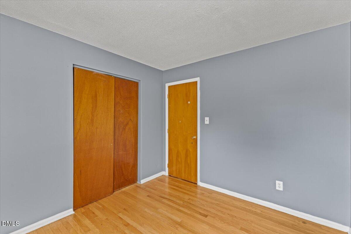 3612 Satellite Court Raleigh, NC 27604 - Photo 21 of 42 a view of an empty room with wooden floor and a window