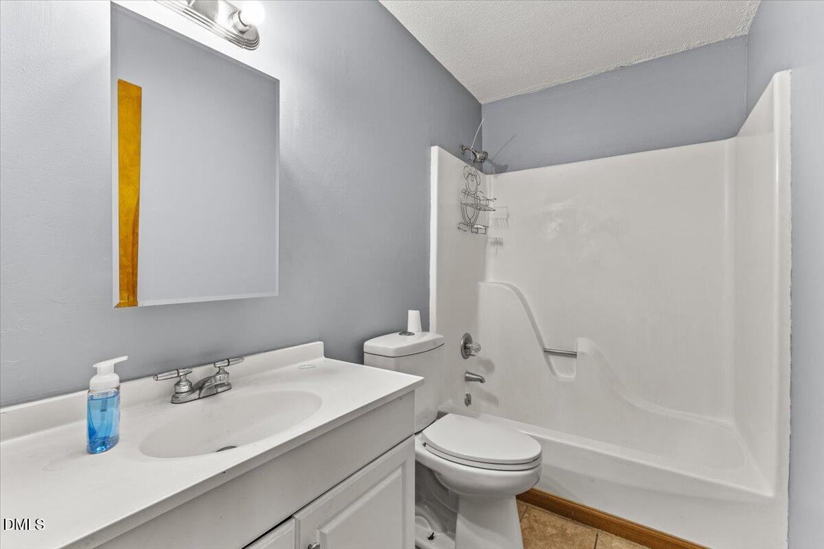 3612 Satellite Court Raleigh, NC 27604 - Photo 22 of 42 a bathroom with a sink and a mirror