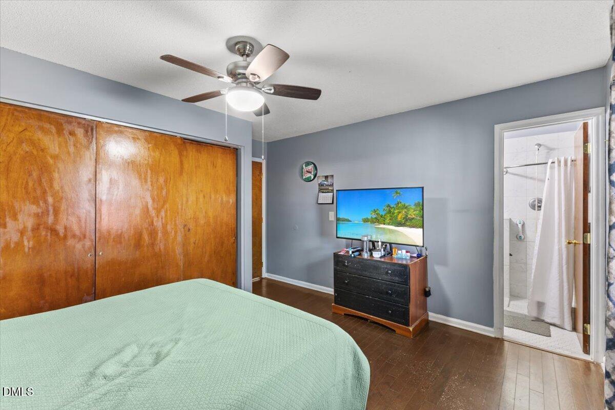 3612 Satellite Court Raleigh, NC 27604 - Photo 27 of 42 a bedroom with a bed and a flat screen tv