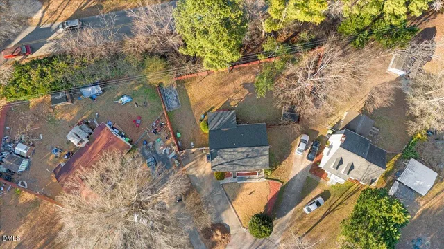 an aerial view of a house with a yard and garden