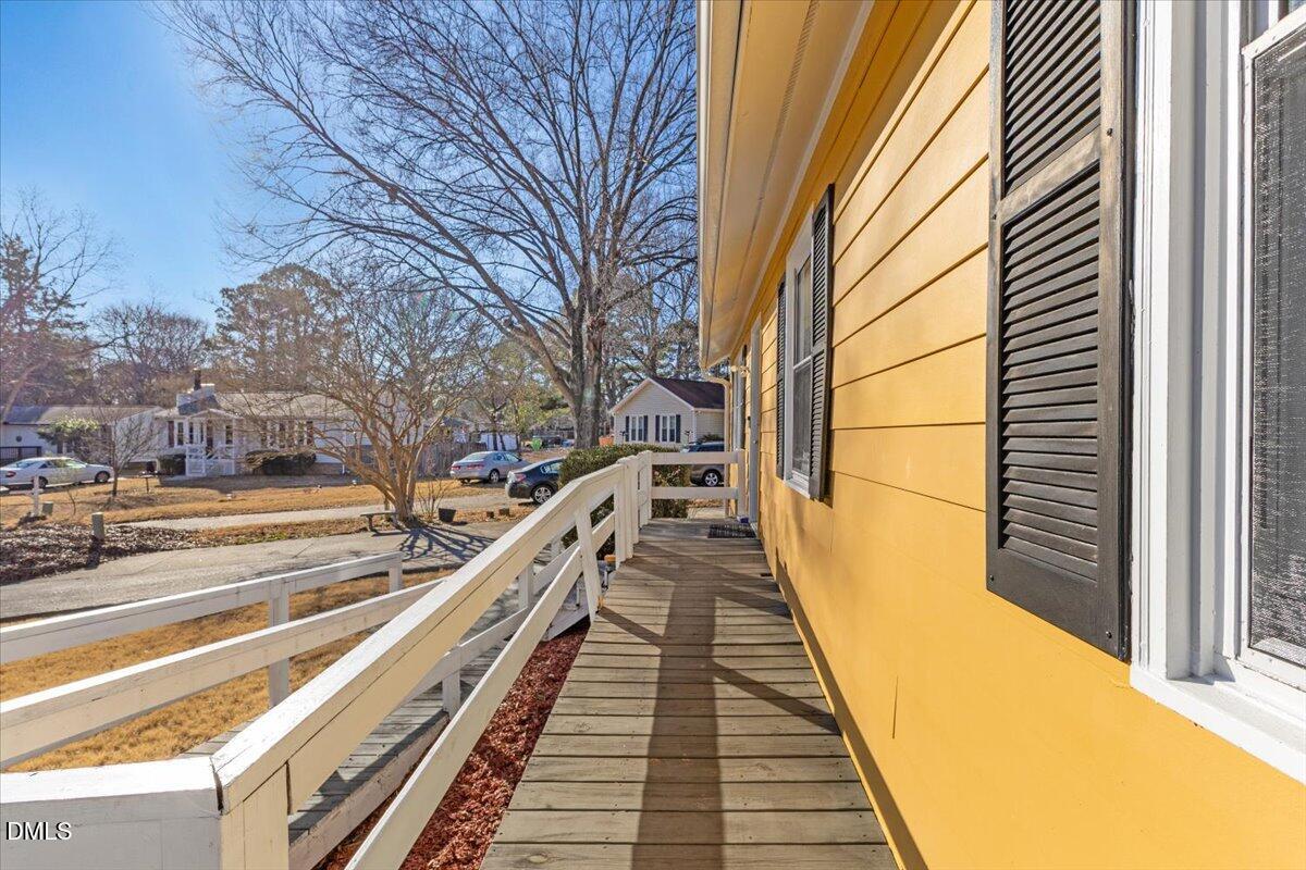 3612 Satellite Court Raleigh, NC 27604 - Photo 6 of 42 a view of balcony with wooden floor and fence
