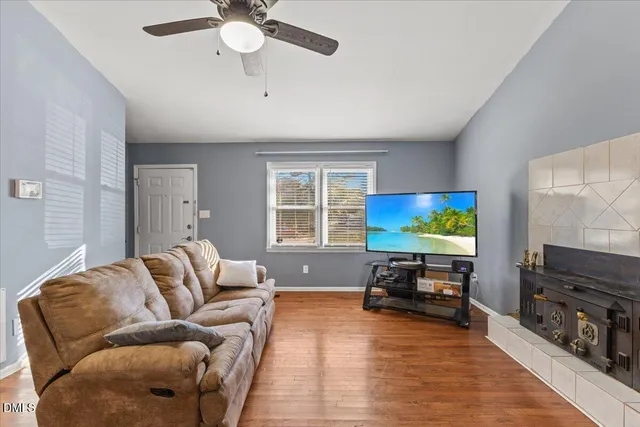 a living room with furniture and a flat screen tv