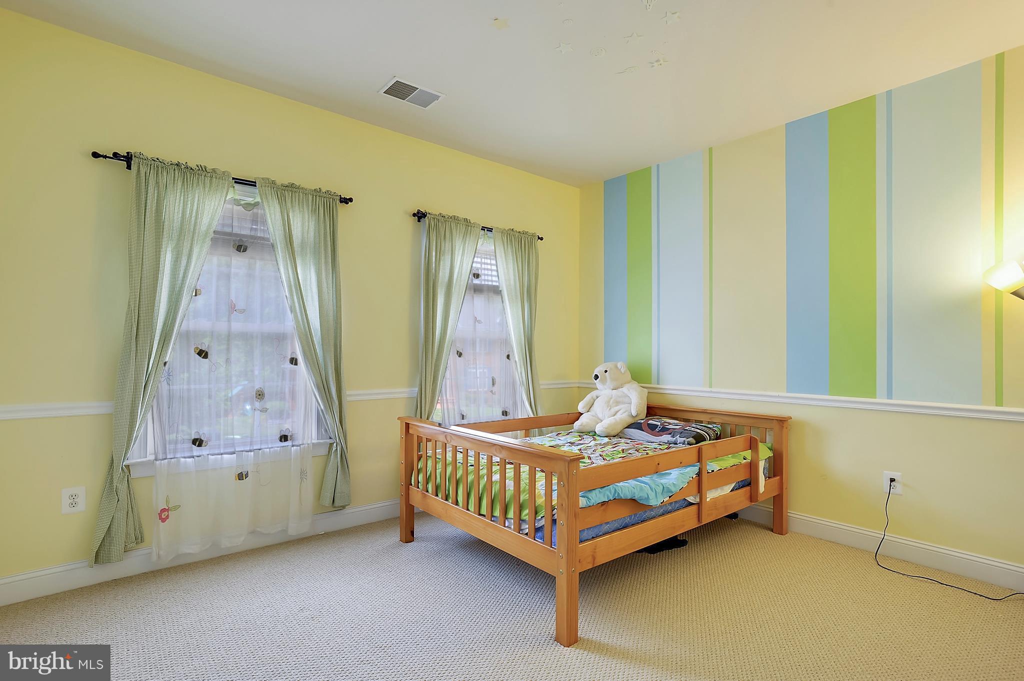 4855 Muddler Way Fairfax, VA 22030 - Photo 18 of 30 a bedroom with a bed and a table