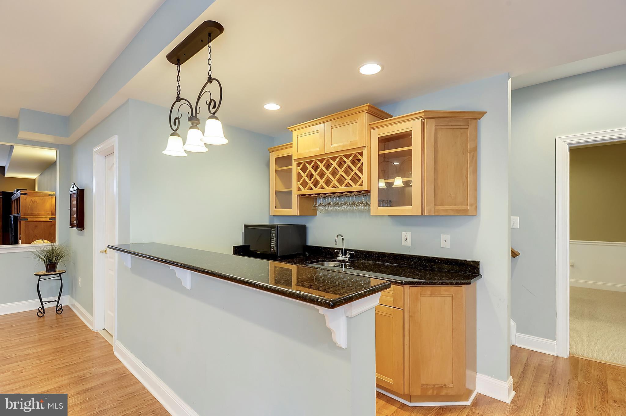 4855 Muddler Way Fairfax, VA 22030 - Photo 22 of 30 a kitchen with a sink and a refrigerator