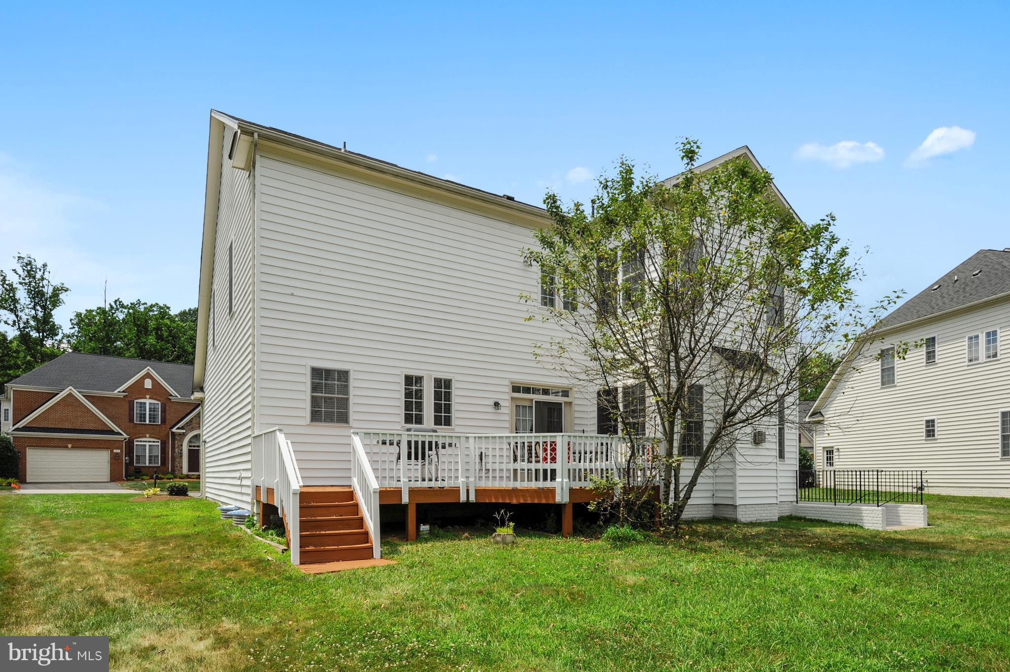 4855 Muddler Way Fairfax, VA 22030 - Photo 30 of 30 a backyard of a house with table and chairs
