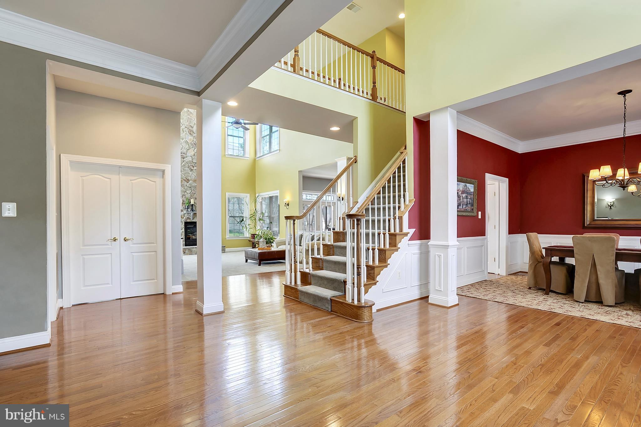 4855 Muddler Way Fairfax, VA 22030 - Photo 5 of 30 a view of an entryway with wooden floor and windows