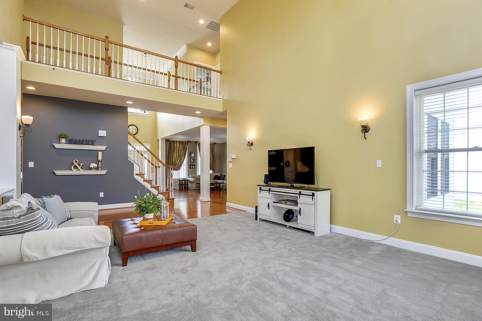 4855 Muddler Way Fairfax, VA 22030 - Photo 7 of 30 a living room with furniture and a flat screen tv