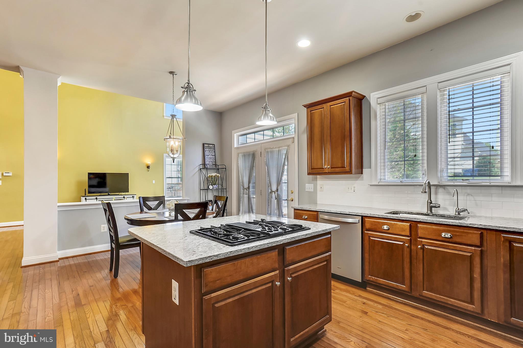 4855 Muddler Way Fairfax, VA 22030 - Photo 9 of 30 a kitchen with a stove a sink dishwasher and a refrigerator