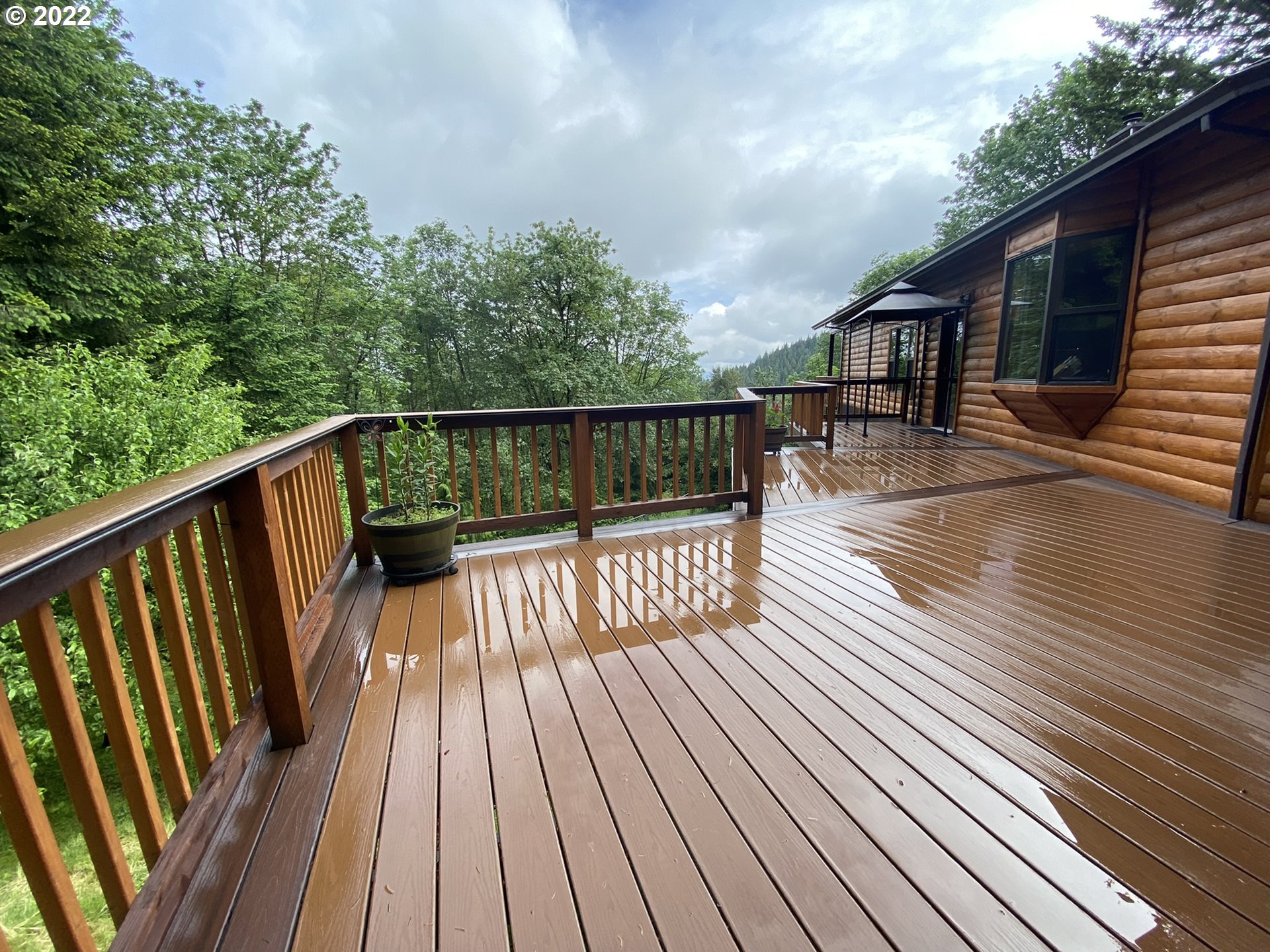 8757 Southeast Alder Ridge Road Damascus, OR 97089 - Photo 16 of 25 a view of balcony with wooden floor and fence