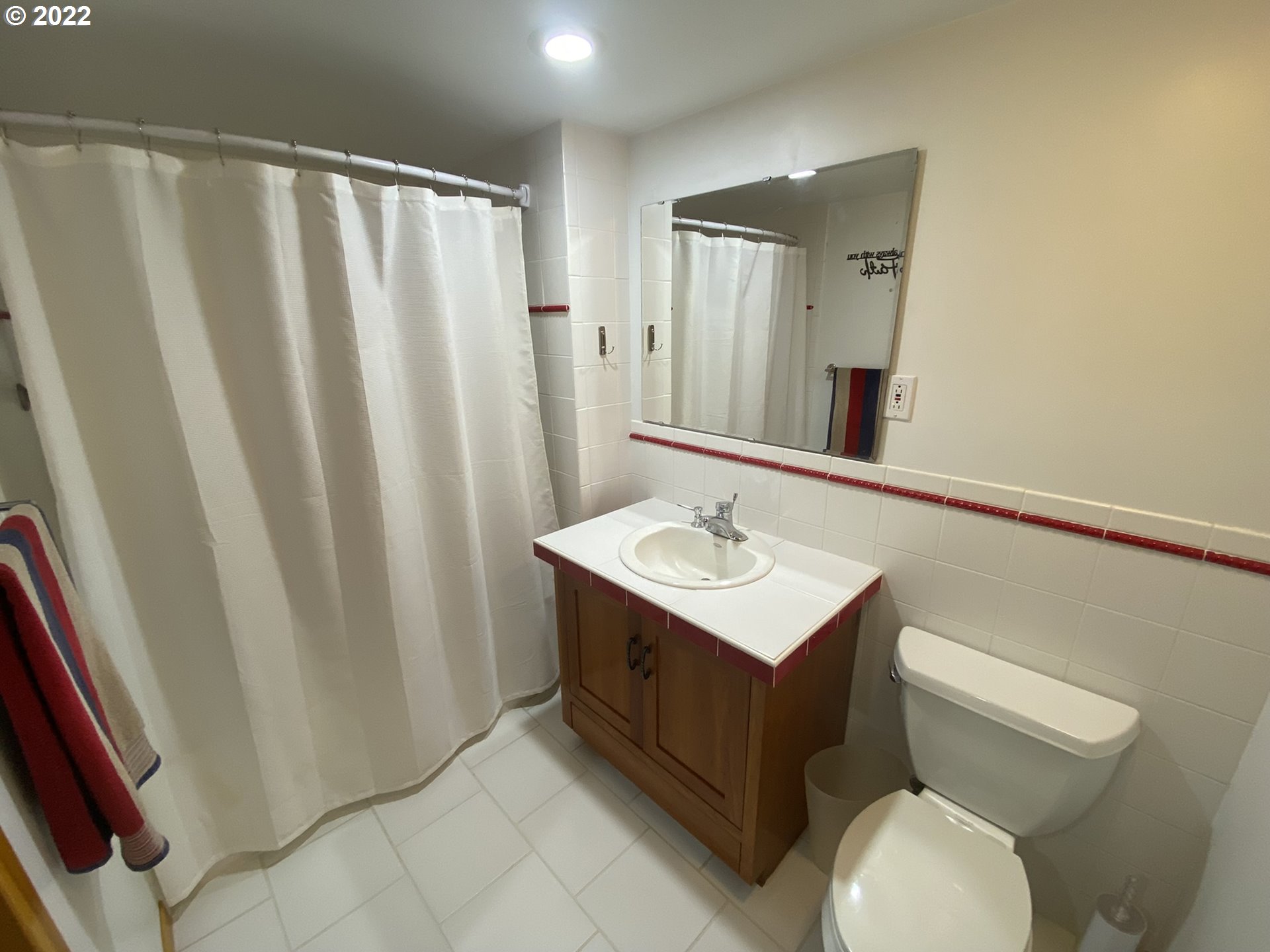 8757 Southeast Alder Ridge Road Damascus, OR 97089 - Photo 21 of 25 a bathroom with a sink a toilet and shower