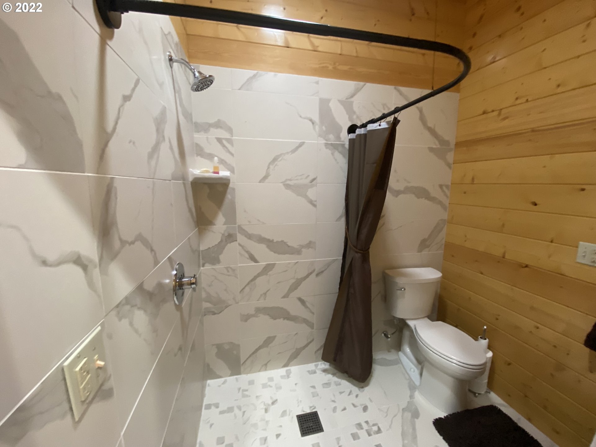 8757 Southeast Alder Ridge Road Damascus, OR 97089 - Photo 24 of 25 a bathroom with a toilet and a shower