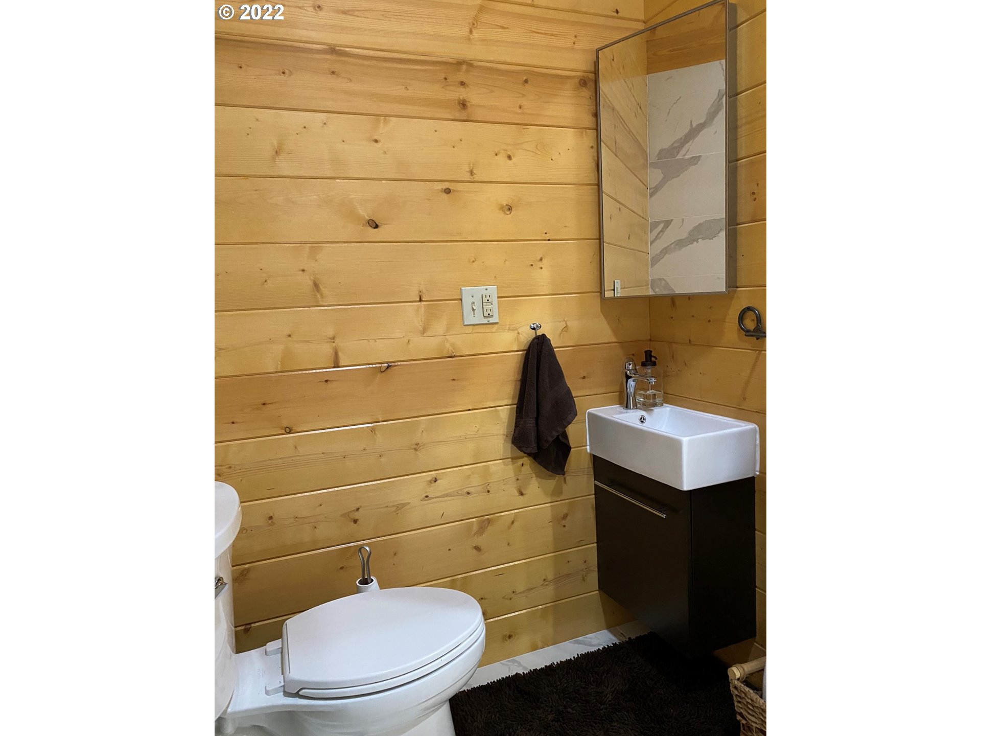 8757 Southeast Alder Ridge Road Damascus, OR 97089 - Photo 25 of 25 a bathroom with a sink and a toilet