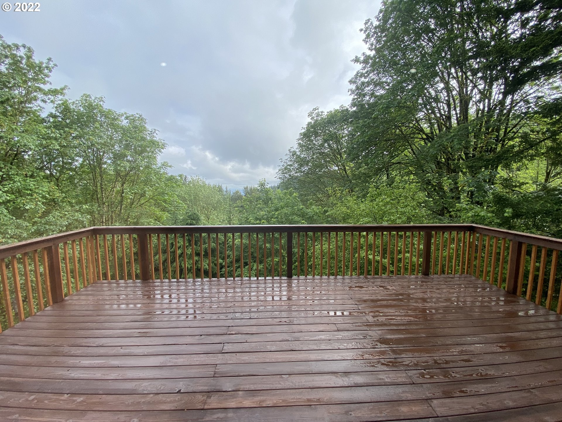 8757 Southeast Alder Ridge Road Damascus, OR 97089 - Photo 8 of 25 a view of deck with a lake view