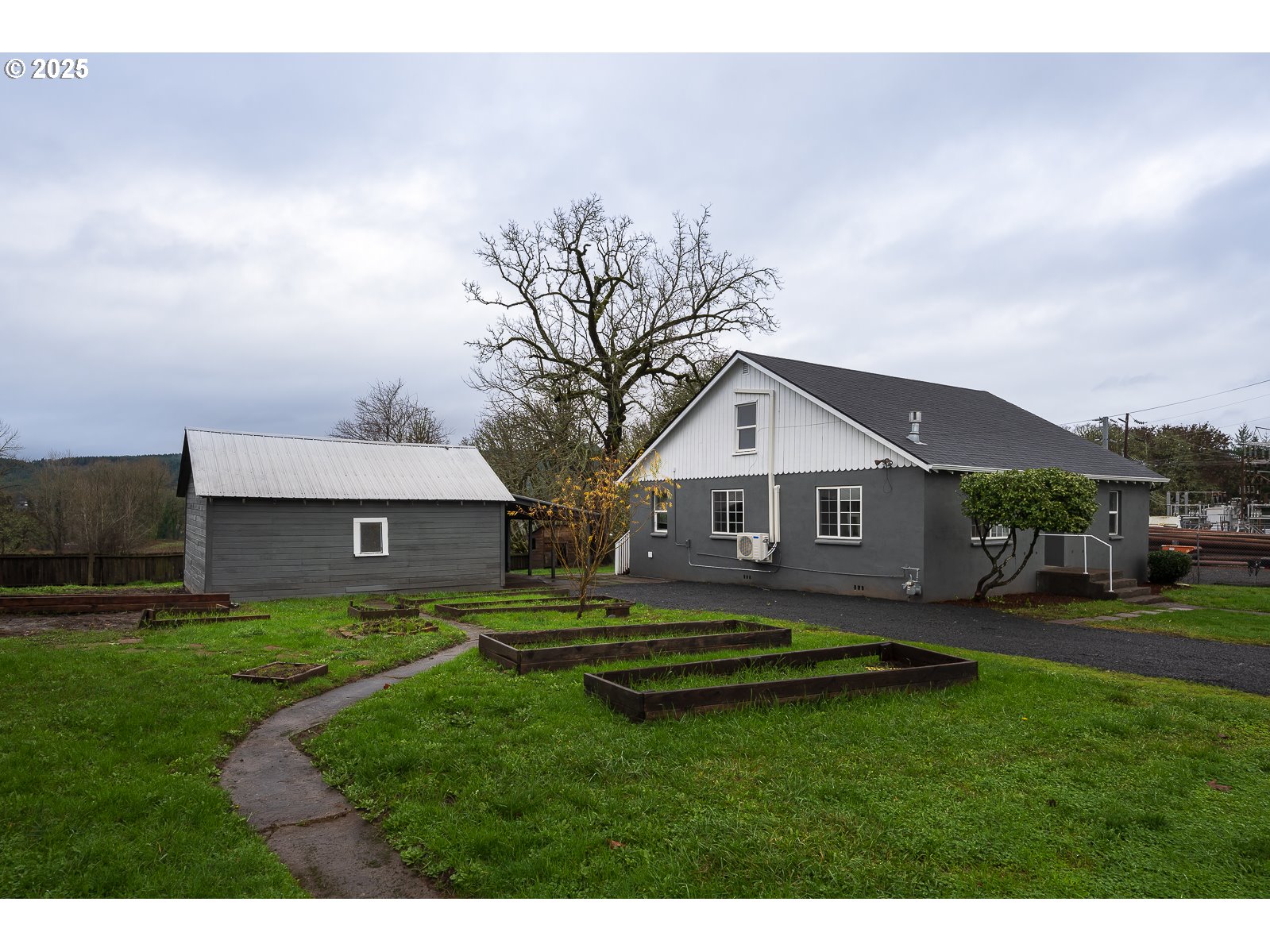 445 Southwest Mill Street Sheridan, OR 97378 - Photo 2 of 38 a front view of house with yard and green space