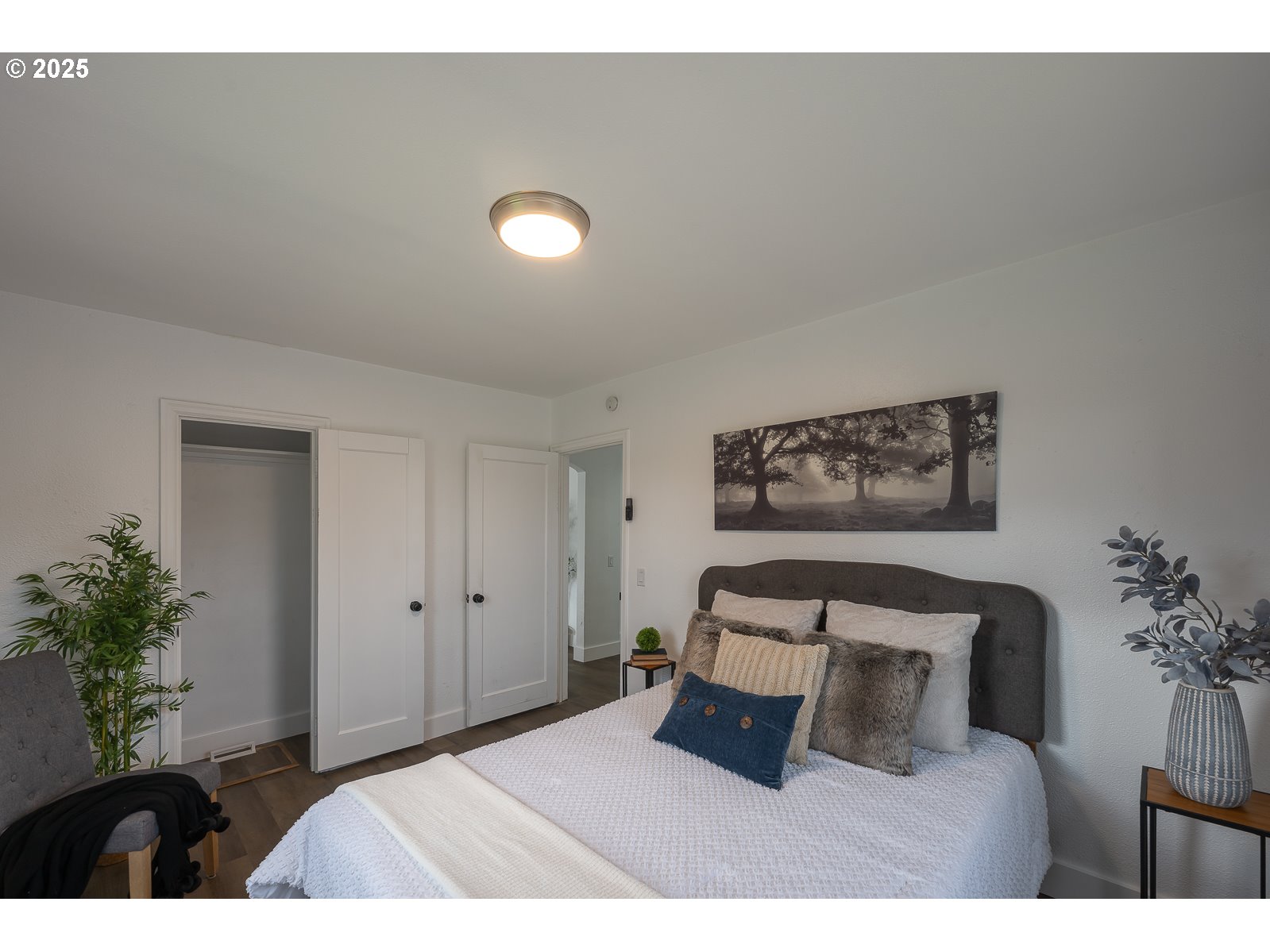 445 Southwest Mill Street Sheridan, OR 97378 - Photo 22 of 38 a bedroom with a bed and a painting on the wall