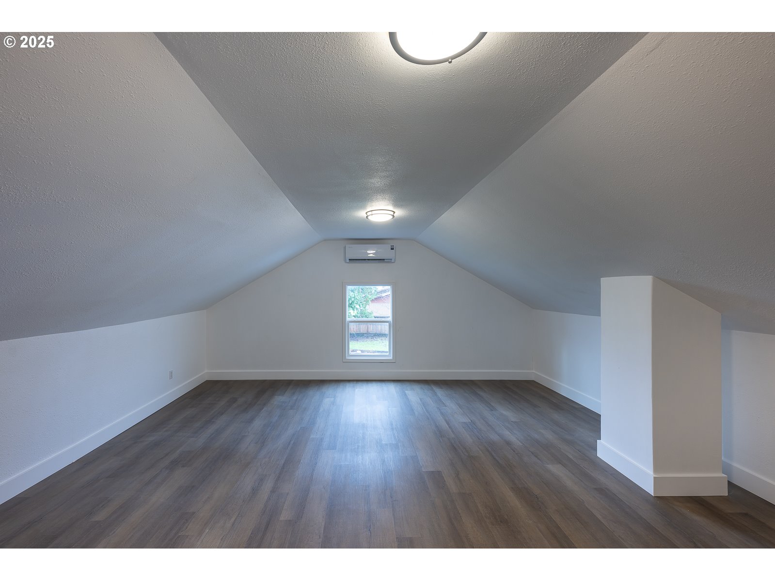 445 Southwest Mill Street Sheridan, OR 97378 - Photo 33 of 38 a view of an empty room with wooden floor and a window