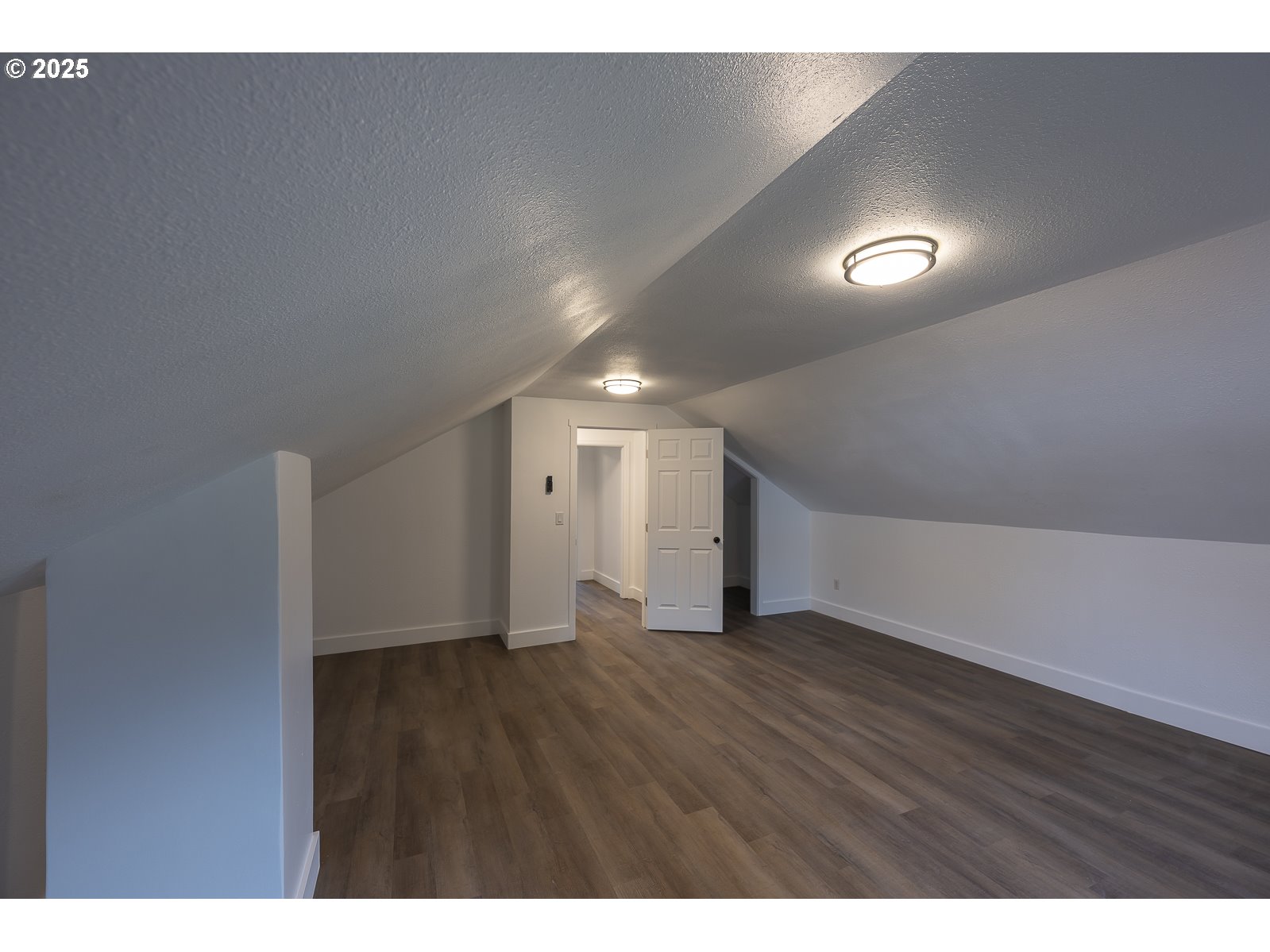 445 Southwest Mill Street Sheridan, OR 97378 - Photo 36 of 38 a view of an empty room with wooden floor