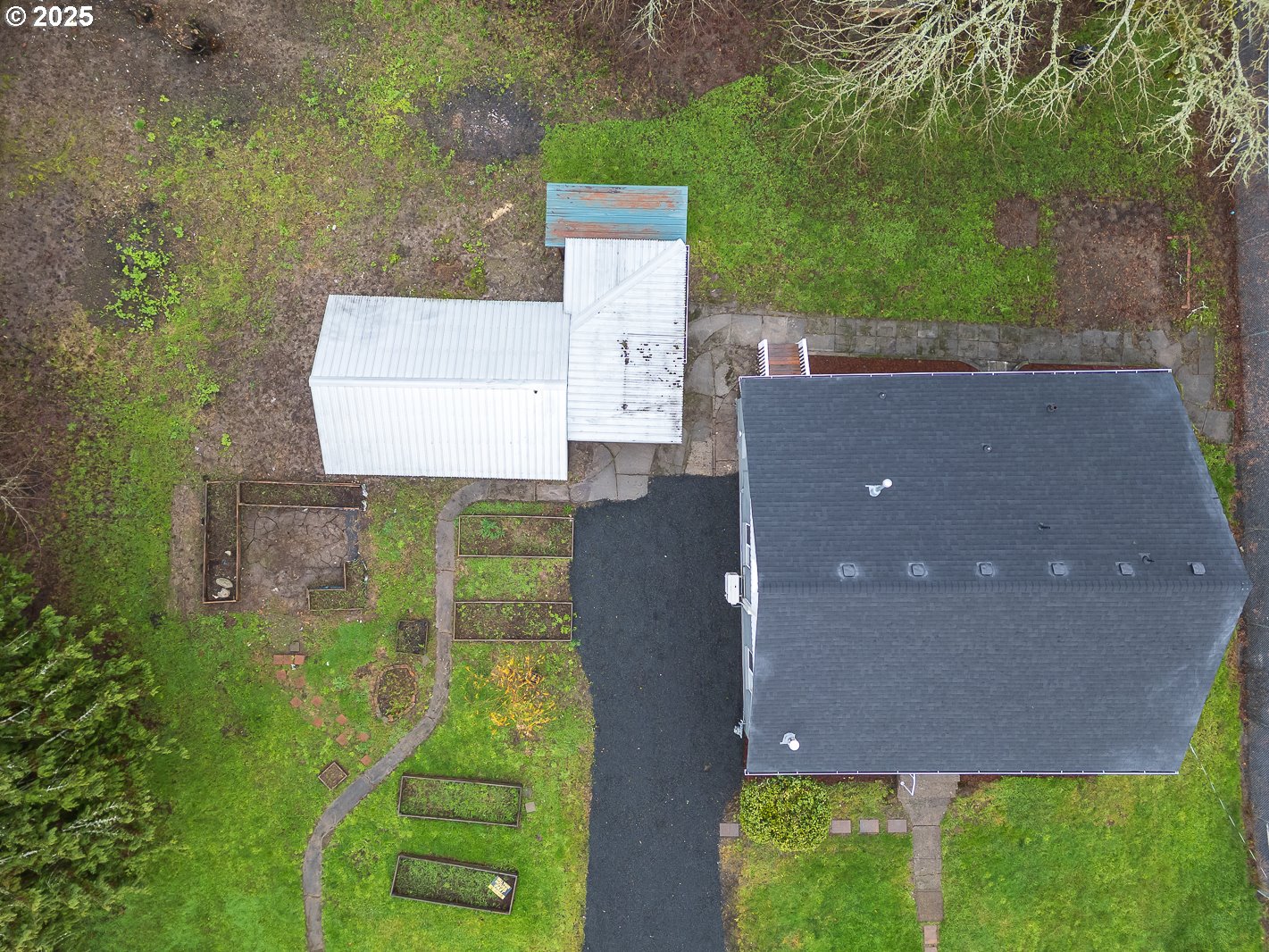 445 Southwest Mill Street Sheridan, OR 97378 - Photo 7 of 38 an aerial view of a house with a yard and a large tree