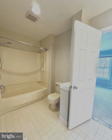 a view of swimming pool with seating space