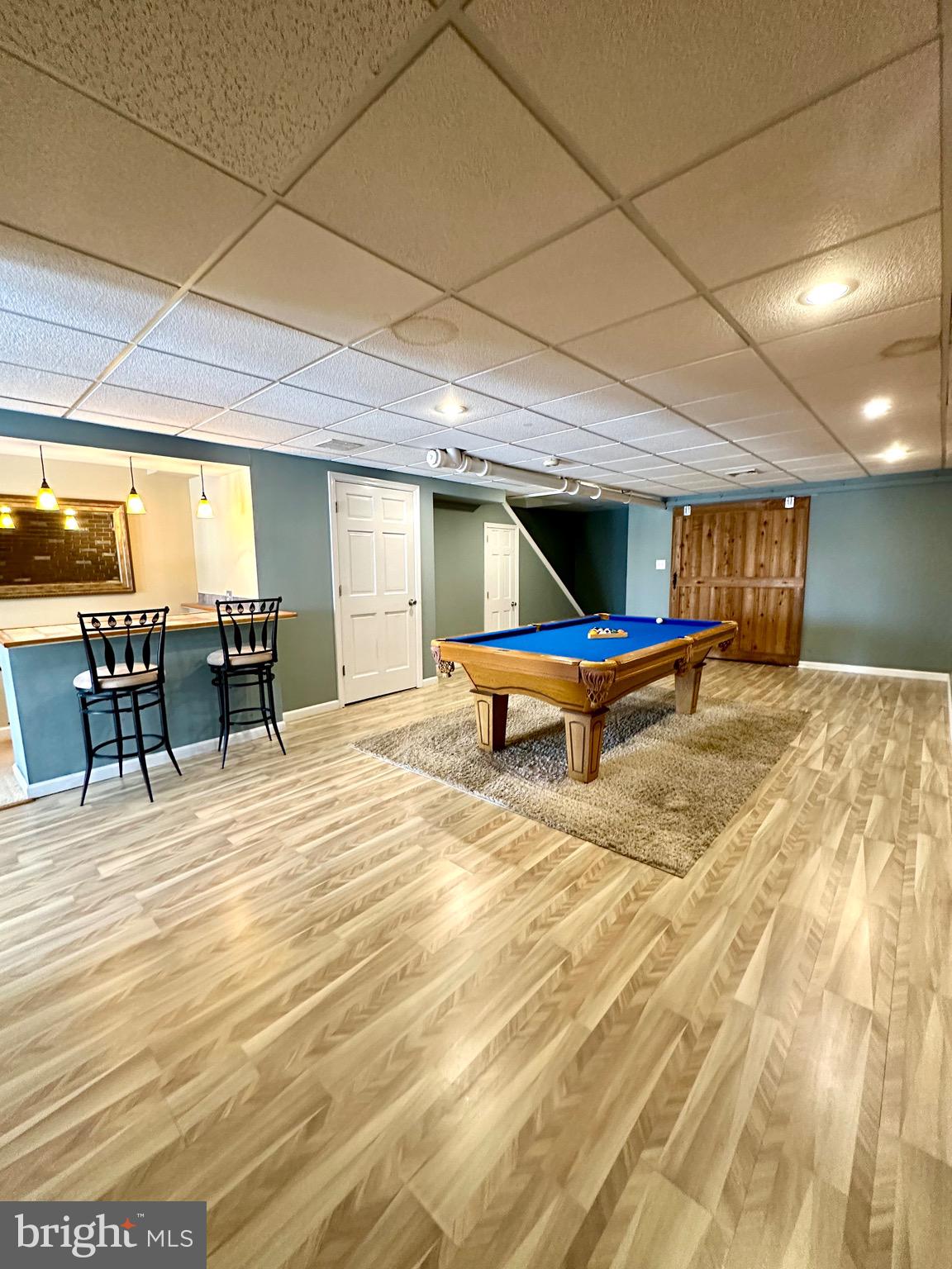 41 Victoria Drive Aston, PA 19014 - Photo 16 of 19 a room with wooden floor table tennis pool table and chairs